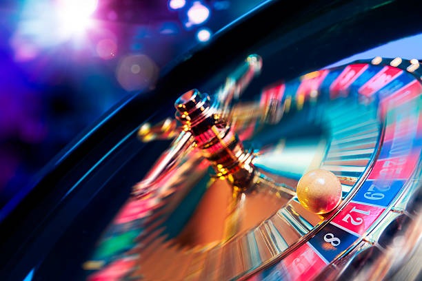 Mobile phone screen showing live roulette table interface with betting chips and dealer view